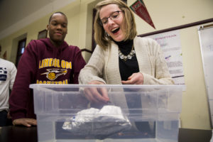 Hannah Brennan (right) and Steve Wilson (left), Lindblom Math and Science Academy freshmen, test their boat that aims to hold as many pennies as possible as part of a University of Michigan Alternative Spring Break program by in Chicago, IL on March 1, 2016. The Michigan students are part of a NSBE/SHPE conglomeration that is running a series of STEM-based workshops within various schools in Chicago during their spring break. Photo: Joseph Xu/Michigan Engineering Multimedia Content Producer, University of Michigan